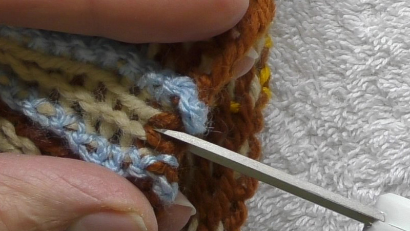 Cutting between the centre stitches,
