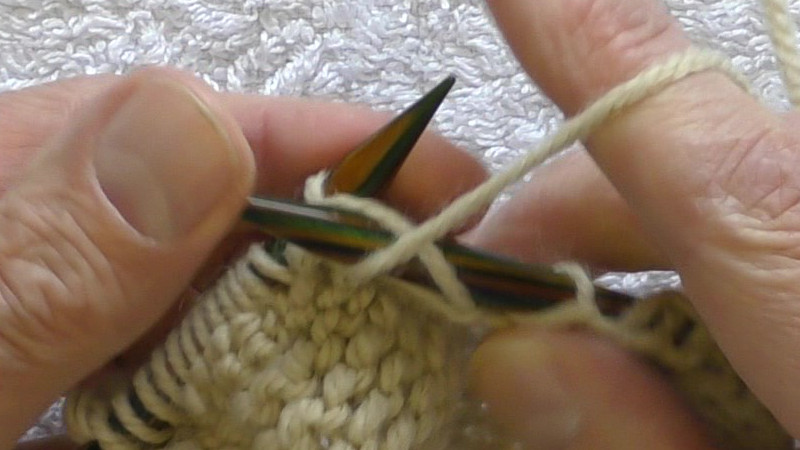 New stitch on the left hand needle being pushed onto the shaft of that needle before the right hand needle is taken out of the old stitch.