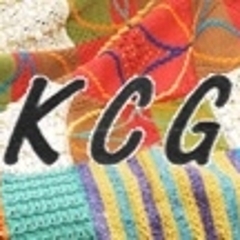 The letters KGN shown on top of a section of knitted blanket.